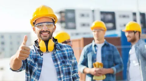 Recruitment team consulting with warehouse staff on-site
