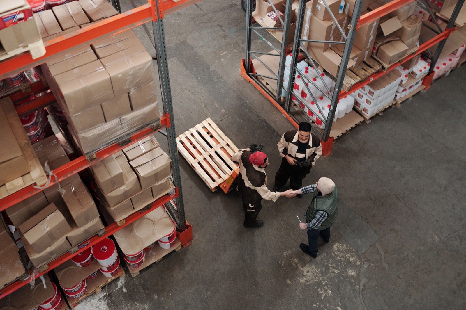 Warehouse and logistics workers coordinating on-site