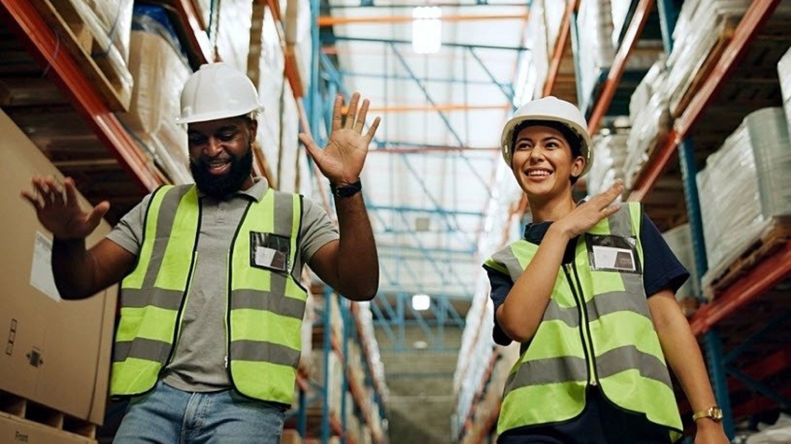 Warehouse workers celebrating a successful placement